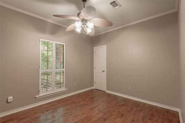 426 County Road 222, Nacogdoches, TX 75965 - empty room with wood finished floors, ornamental molding, and ceiling fan