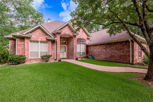 426 County Road 222, Nacogdoches, TX 75965 - single story home with brick siding, a front yard, a chimney, and roof with shingles