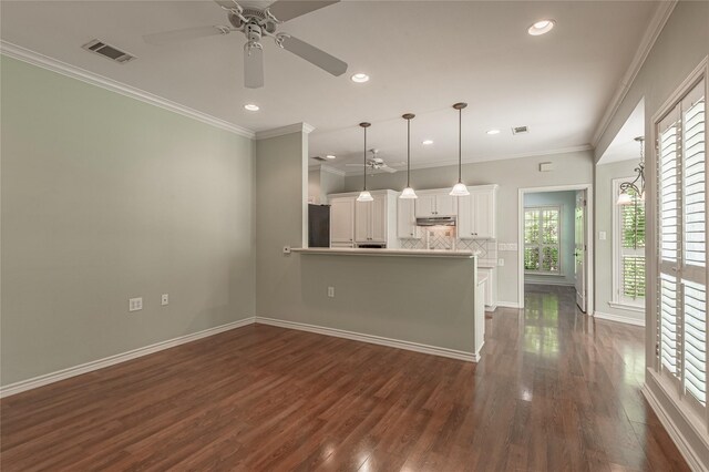 426 County Road 222, Nacogdoches, TX 75965 - kitchen featuring a ceiling fan, under cabinet range hood, freestanding refrigerator, dark wood finished floors, and recessed lighting