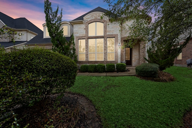 119 Reese Run St, Montgomery, TX 77316 - french country style house with stone siding, a yard, and brick siding