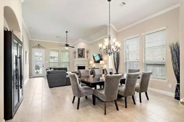 119 Reese Run St, Montgomery, TX 77316 - dining space with a fireplace, crown molding, light tile patterned floors, ceiling fan, and a chandelier