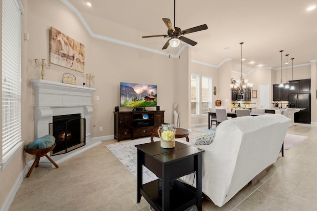 119 Reese Run St, Montgomery, TX 77316 - living area with a ceiling fan, ornamental molding, a lit fireplace, recessed lighting, and light tile patterned floors