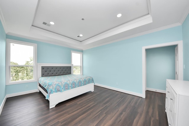 1309 24th St, Dickinson, TX 77539 - bedroom with a raised ceiling, dark wood-type flooring, ornamental molding, and recessed lighting