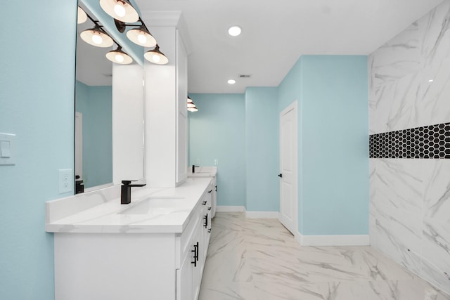 1309 24th St, Dickinson, TX 77539 - bathroom featuring double vanity, marble finish floors, a marble finish shower, and recessed lighting