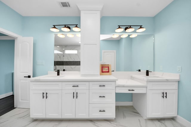 1309 24th St, Dickinson, TX 77539 - full bathroom featuring marble look tile flooring, vanity, and a marble finish shower