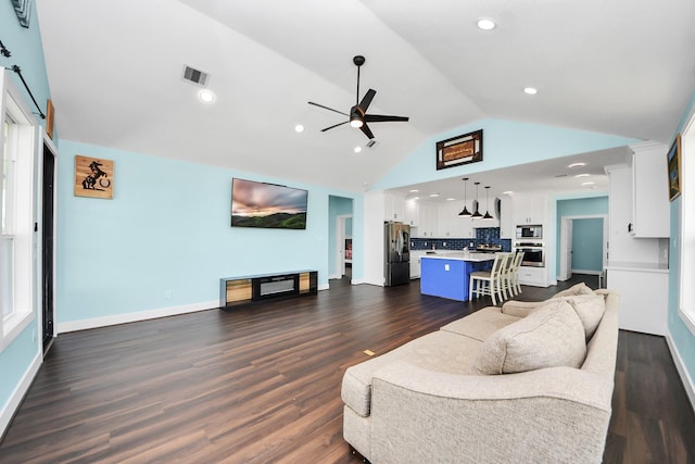 1309 24th St, Dickinson, TX 77539 - living area with lofted ceiling, ceiling fan, dark wood-type flooring, and recessed lighting