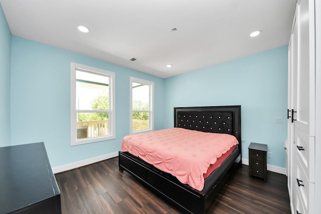 1309 24th St, Dickinson, TX 77539 - bedroom with dark wood-style flooring and recessed lighting