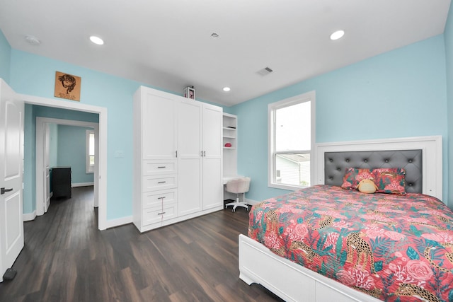 1309 24th St, Dickinson, TX 77539 - bedroom featuring multiple windows, dark wood finished floors, and recessed lighting