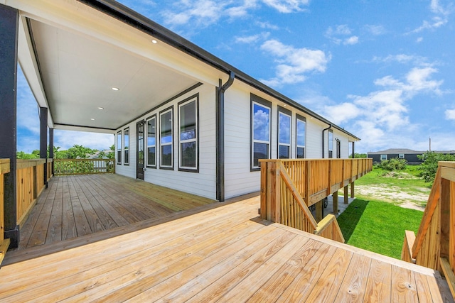 1309 24th St, Dickinson, TX 77539 - deck featuring a lawn