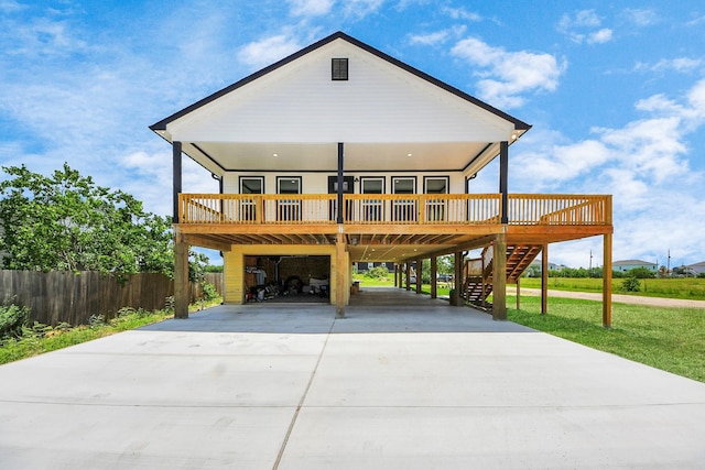 1309 24th St, Dickinson, TX 77539 - beach home featuring a carport, driveway, stairway, and covered porch