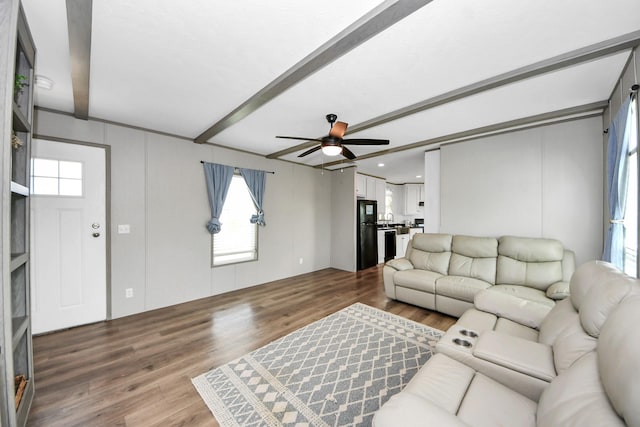 1309 24th St, Dickinson, TX 77539 - living area featuring wood finished floors, ceiling fan, and beamed ceiling