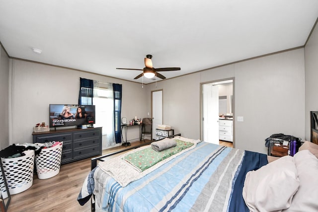 1309 24th St, Dickinson, TX 77539 - bedroom with wood finished floors, a ceiling fan, and crown molding