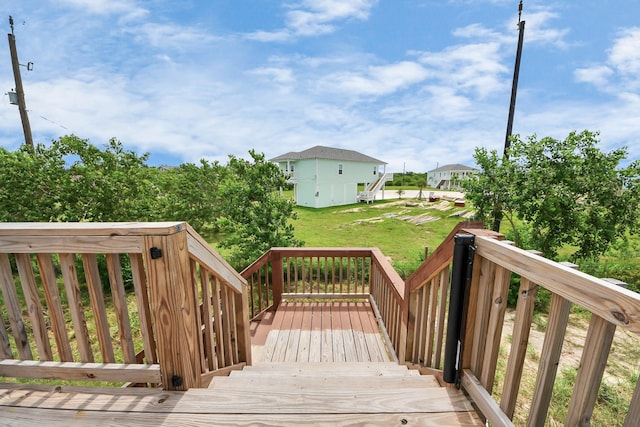 1309 24th St, Dickinson, TX 77539 - wooden deck featuring a lawn