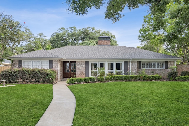 5659 Chevy Chase Dr, Houston, TX 77056 - single story home with brick siding, a chimney, french doors, roof with shingles, and a front lawn