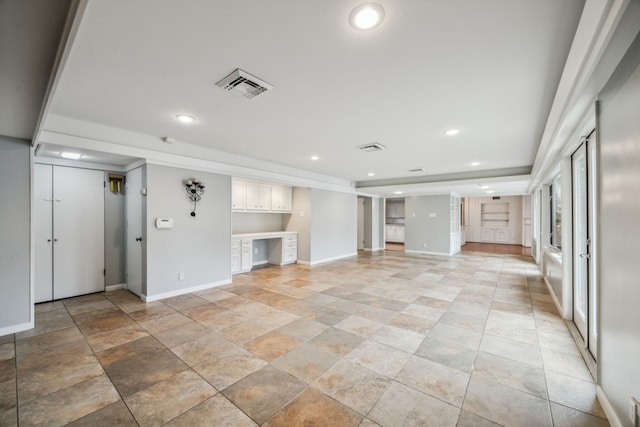 5659 Chevy Chase Dr, Houston, TX 77056 - unfurnished living room featuring built in desk and recessed lighting