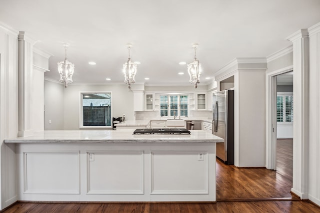 5659 Chevy Chase Dr, Houston, TX 77056 - kitchen with stainless steel appliances, a chandelier, white cabinets, glass insert cabinets, and light stone counters
