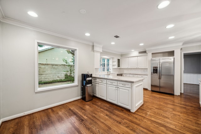 5659 Chevy Chase Dr, Houston, TX 77056 - kitchen featuring stainless steel fridge with ice dispenser, a peninsula, white cabinets, dark wood-style flooring, and ornamental molding