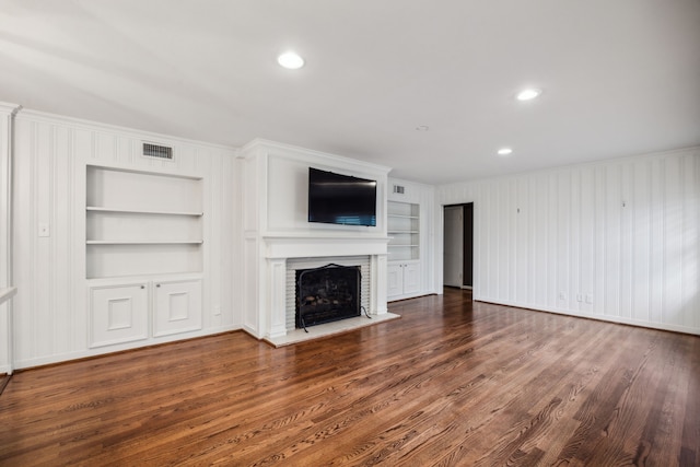 5659 Chevy Chase Dr, Houston, TX 77056 - unfurnished living room featuring built in shelves, a fireplace, crown molding, wood finished floors, and recessed lighting