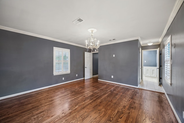 5659 Chevy Chase Dr, Houston, TX 77056 - spare room featuring a chandelier, wood finished floors, and ornamental molding