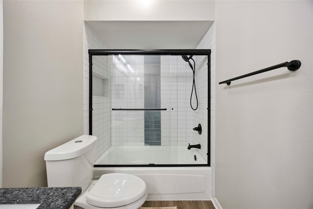 20315 Maple Village Dr, Cypress, TX 77433 - bathroom featuring combined bath / shower with glass door, wood finished floors, and vanity