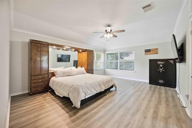 20315 Maple Village Dr, Cypress, TX 77433 - bedroom featuring light wood-style floors, ornamental molding, and a ceiling fan