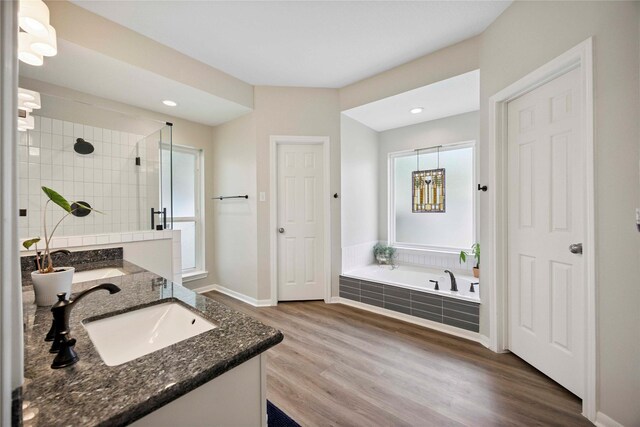 20315 Maple Village Dr, Cypress, TX 77433 - full bathroom with double vanity, a bath, plenty of natural light, a stall shower, and recessed lighting