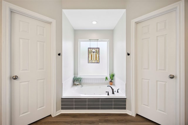 20315 Maple Village Dr, Cypress, TX 77433 - full bathroom featuring a jetted tub and wood finished floors