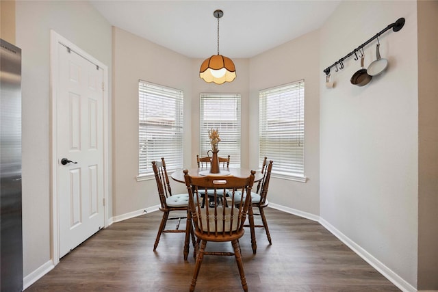 20315 Maple Village Dr, Cypress, TX 77433 - dining space featuring plenty of natural light and dark wood finished floors