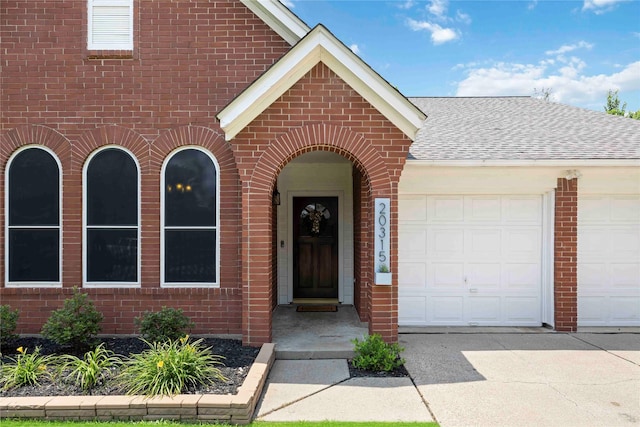 20315 Maple Village Dr, Cypress, TX 77433 - view of front facade featuring brick siding, a garage, a shingled roof, and concrete driveway