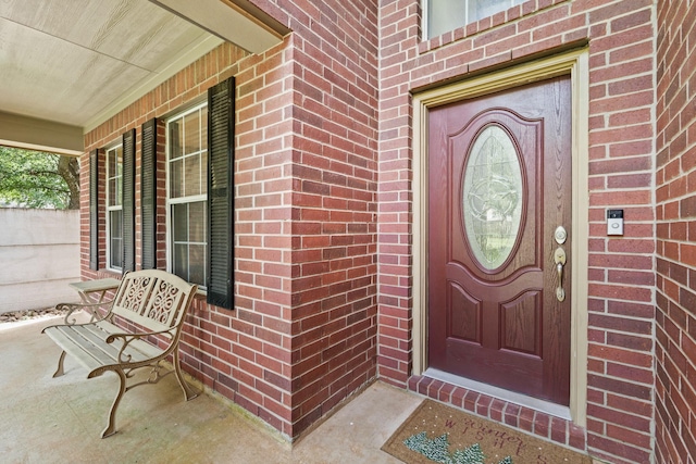 16210 Bloom Meadow Trl, Cypress, TX 77433 - view of exterior entry with a porch and brick siding