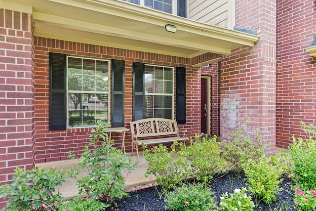 16210 Bloom Meadow Trl, Cypress, TX 77433 - view of exterior entry with a porch and brick siding