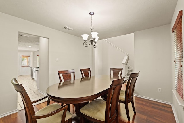 16210 Bloom Meadow Trl, Cypress, TX 77433 - dining room with wood finished floors and a chandelier