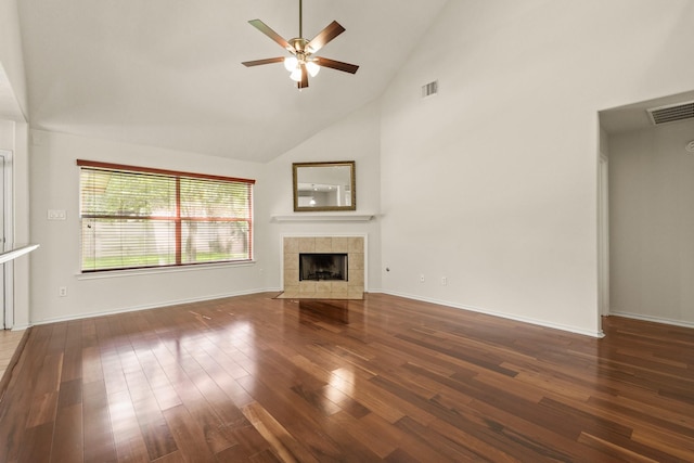 16210 Bloom Meadow Trl, Cypress, TX 77433 - unfurnished living room featuring high vaulted ceiling, a ceiling fan, wood finished floors, and a fireplace