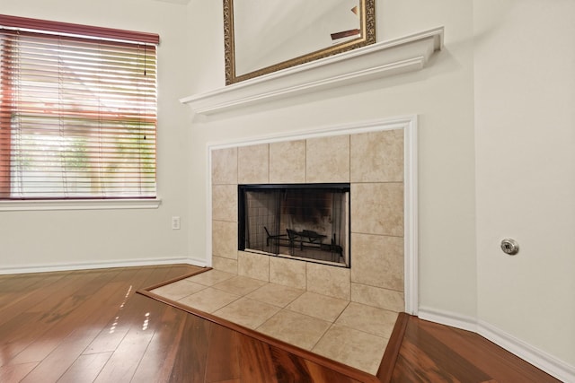 16210 Bloom Meadow Trl, Cypress, TX 77433 - detailed view of wood finished floors and a tile fireplace