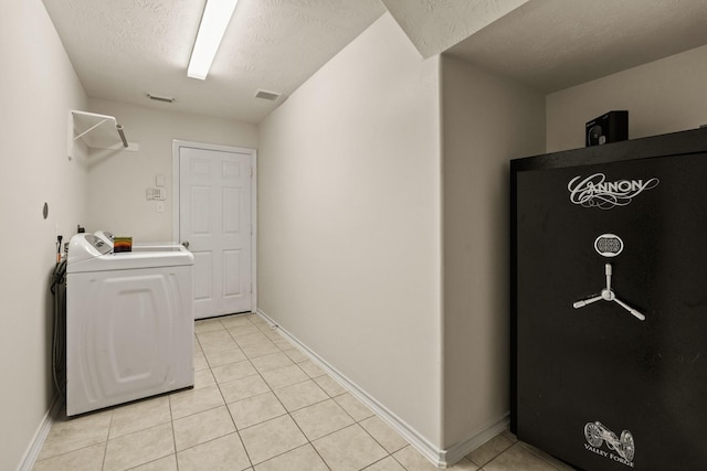 16210 Bloom Meadow Trl, Cypress, TX 77433 - washroom with washer / dryer and light tile patterned floors