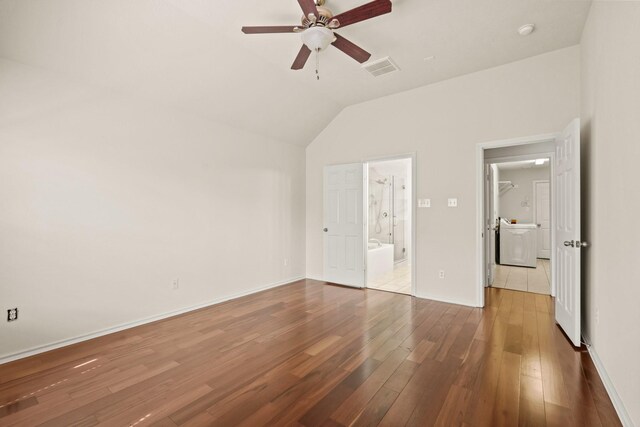 16210 Bloom Meadow Trl, Cypress, TX 77433 - unfurnished bedroom featuring vaulted ceiling, wood-type flooring, ensuite bath, and a ceiling fan