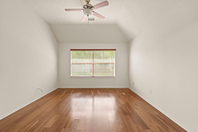 16210 Bloom Meadow Trl, Cypress, TX 77433 - empty room featuring wood finished floors, ceiling fan, and lofted ceiling