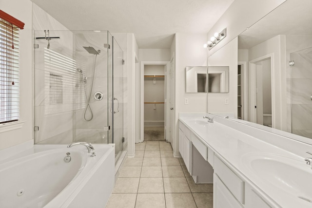 16210 Bloom Meadow Trl, Cypress, TX 77433 - full bath with a stall shower, double vanity, a tub with jets, tile patterned flooring, and a walk in closet