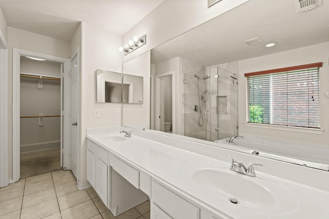 16210 Bloom Meadow Trl, Cypress, TX 77433 - full bath featuring a shower stall, a walk in closet, double vanity, tile patterned floors, and a garden tub