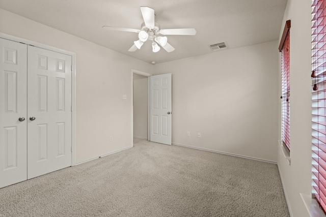 16210 Bloom Meadow Trl, Cypress, TX 77433 - unfurnished bedroom with carpet flooring, a closet, and a ceiling fan