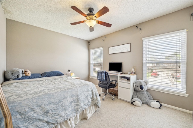 2310 Parkview Dr, Pearland, TX 77581 - bedroom featuring light colored carpet, ceiling fan, and a textured ceiling