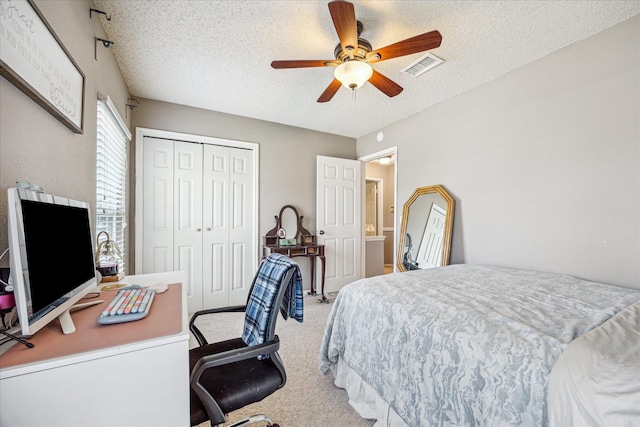 2310 Parkview Dr, Pearland, TX 77581 - bedroom featuring a textured ceiling, a closet, an office area, light colored carpet, and ceiling fan