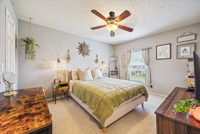 2310 Parkview Dr, Pearland, TX 77581 - bedroom with a textured ceiling, light carpet, and a ceiling fan