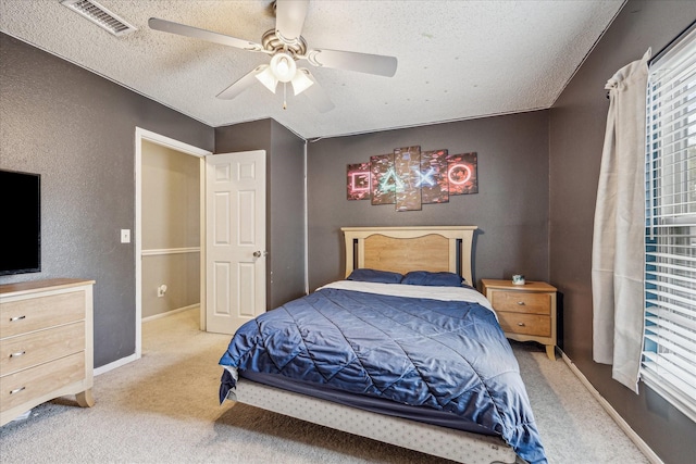 2310 Parkview Dr, Pearland, TX 77581 - carpeted bedroom with a textured ceiling and ceiling fan