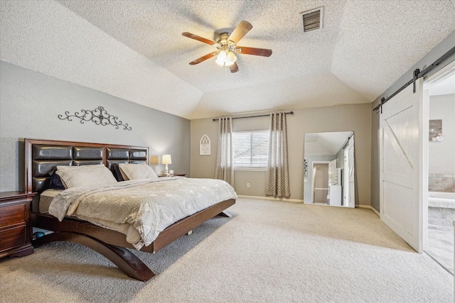 2310 Parkview Dr, Pearland, TX 77581 - bedroom featuring a barn door, carpet flooring, a ceiling fan, lofted ceiling, and a textured ceiling
