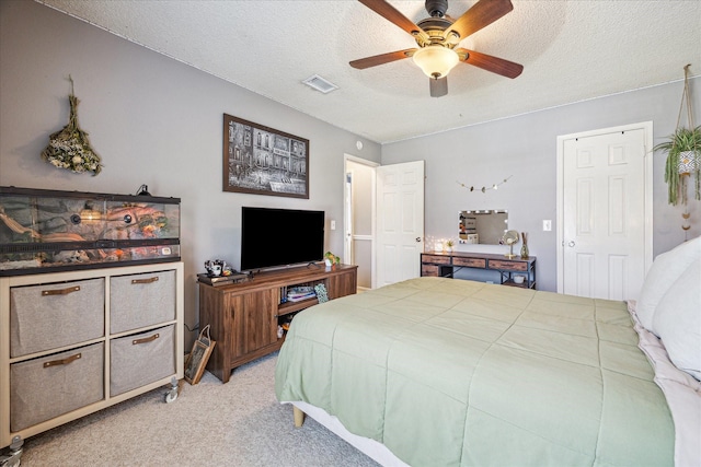 2310 Parkview Dr, Pearland, TX 77581 - bedroom featuring light carpet, a textured ceiling, and ceiling fan