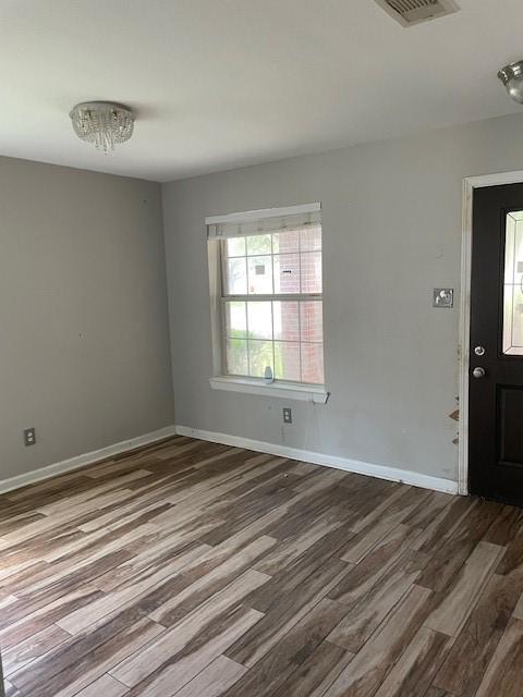 12326 Garden Gale Ln, Houston, TX 77044 - empty room featuring wood finished floors