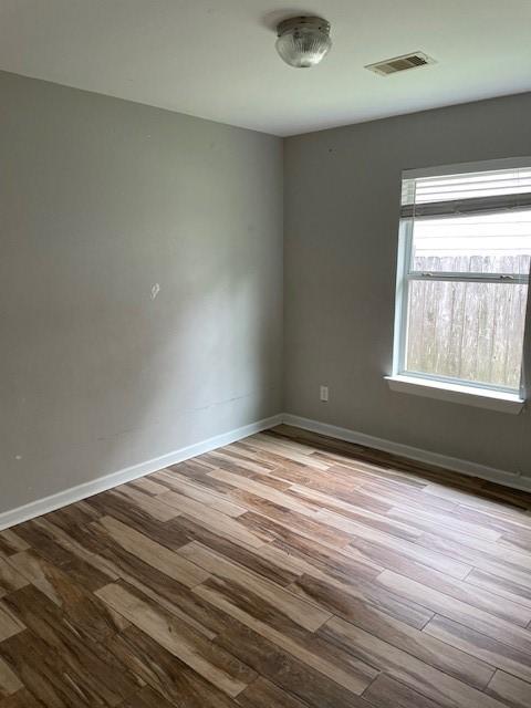 12326 Garden Gale Ln, Houston, TX 77044 - unfurnished room with wood finished floors and baseboards