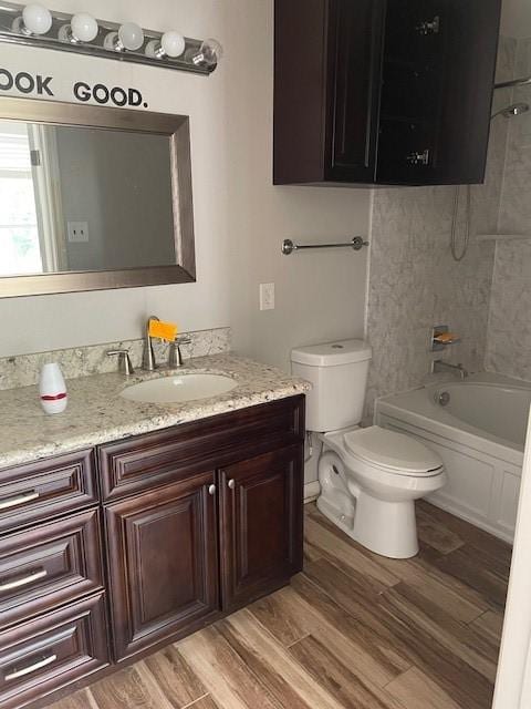 12326 Garden Gale Ln, Houston, TX 77044 - full bathroom with vanity, wood finished floors, and  shower combination