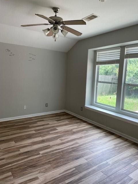 12326 Garden Gale Ln, Houston, TX 77044 - unfurnished room featuring lofted ceiling, wood finished floors, and a ceiling fan